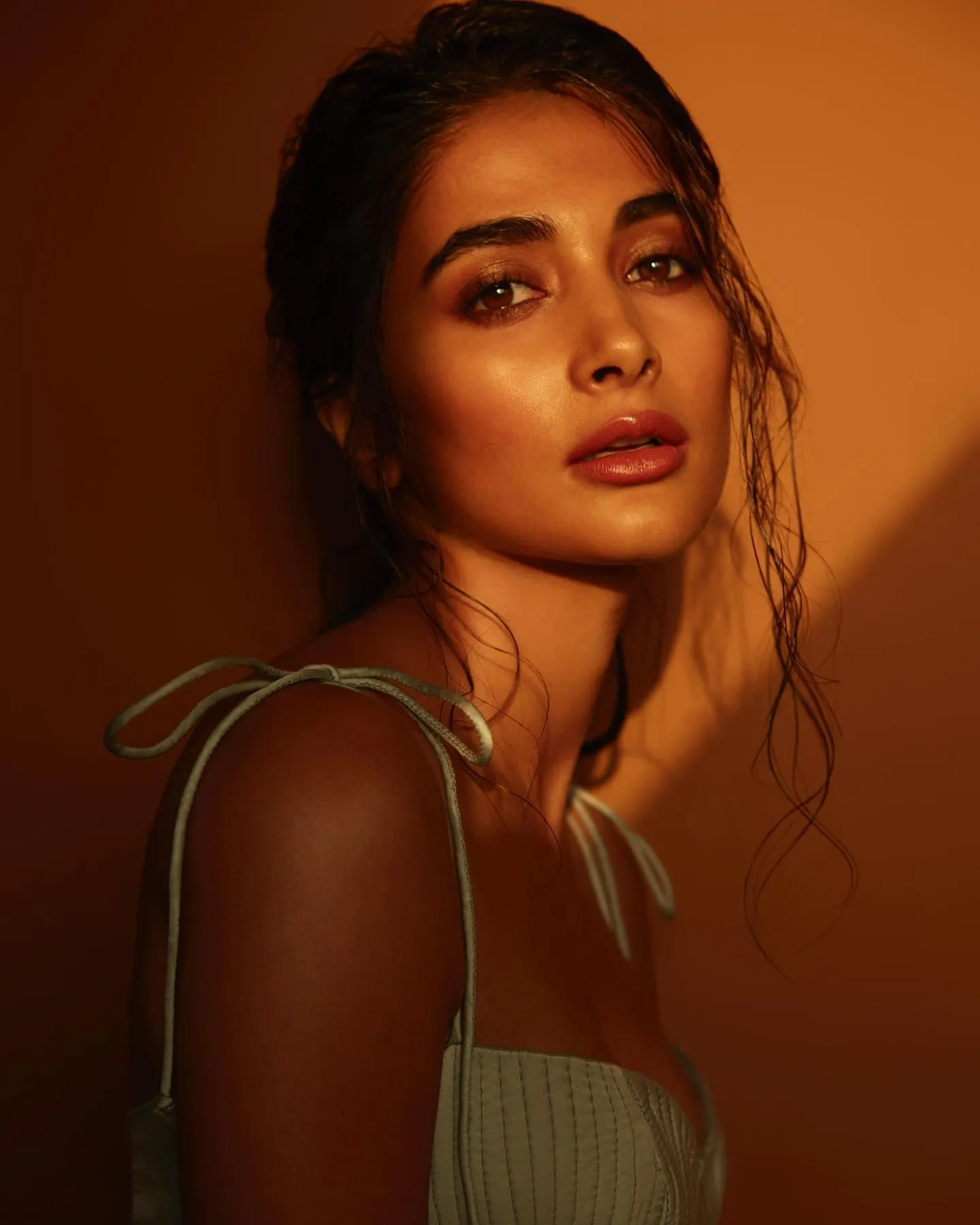 Pooja Hegde in Golden Light Wearing Chic Dress Wallpaper