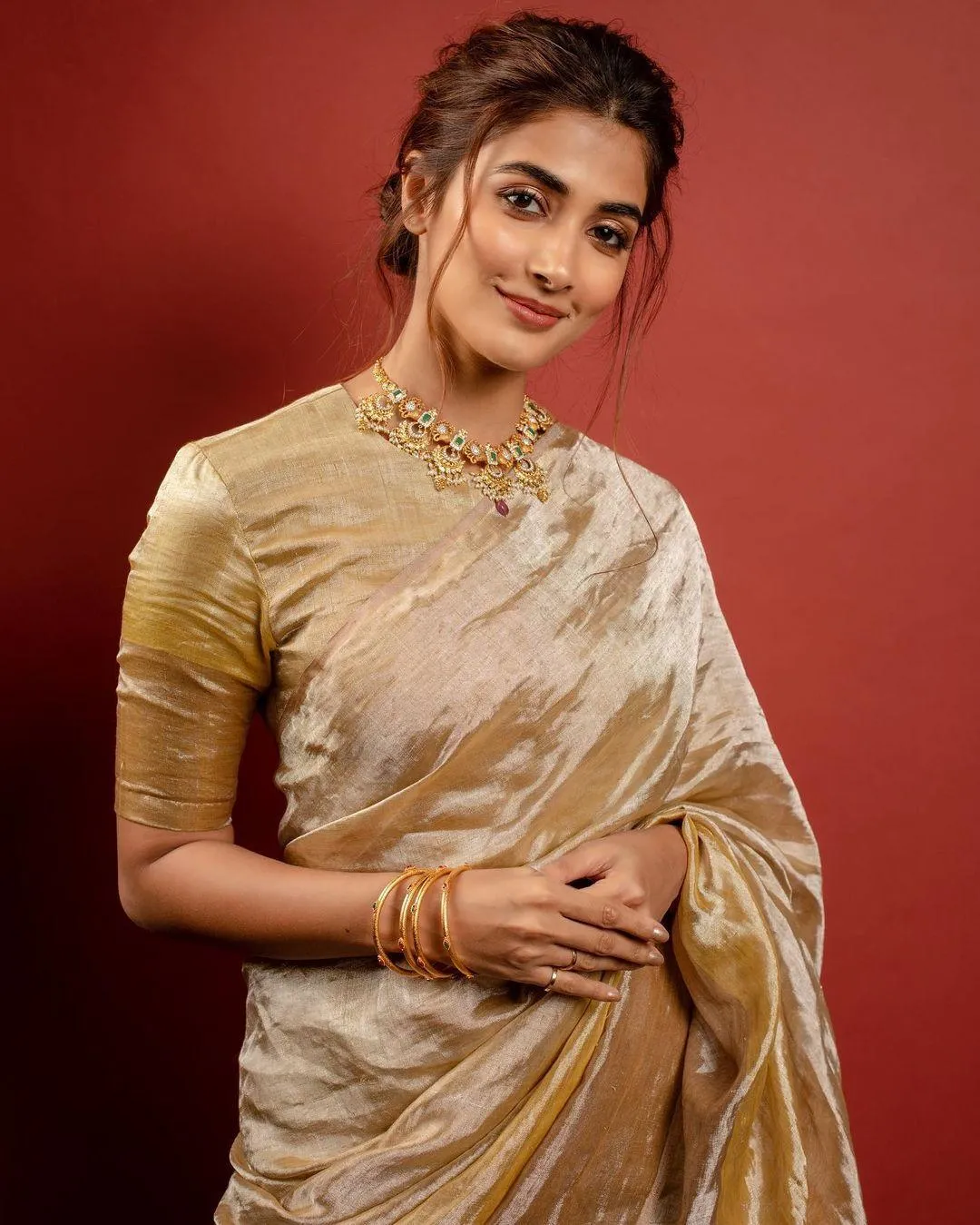 Pooja Hegde in Golden Saree with Hands Folded Elegantly