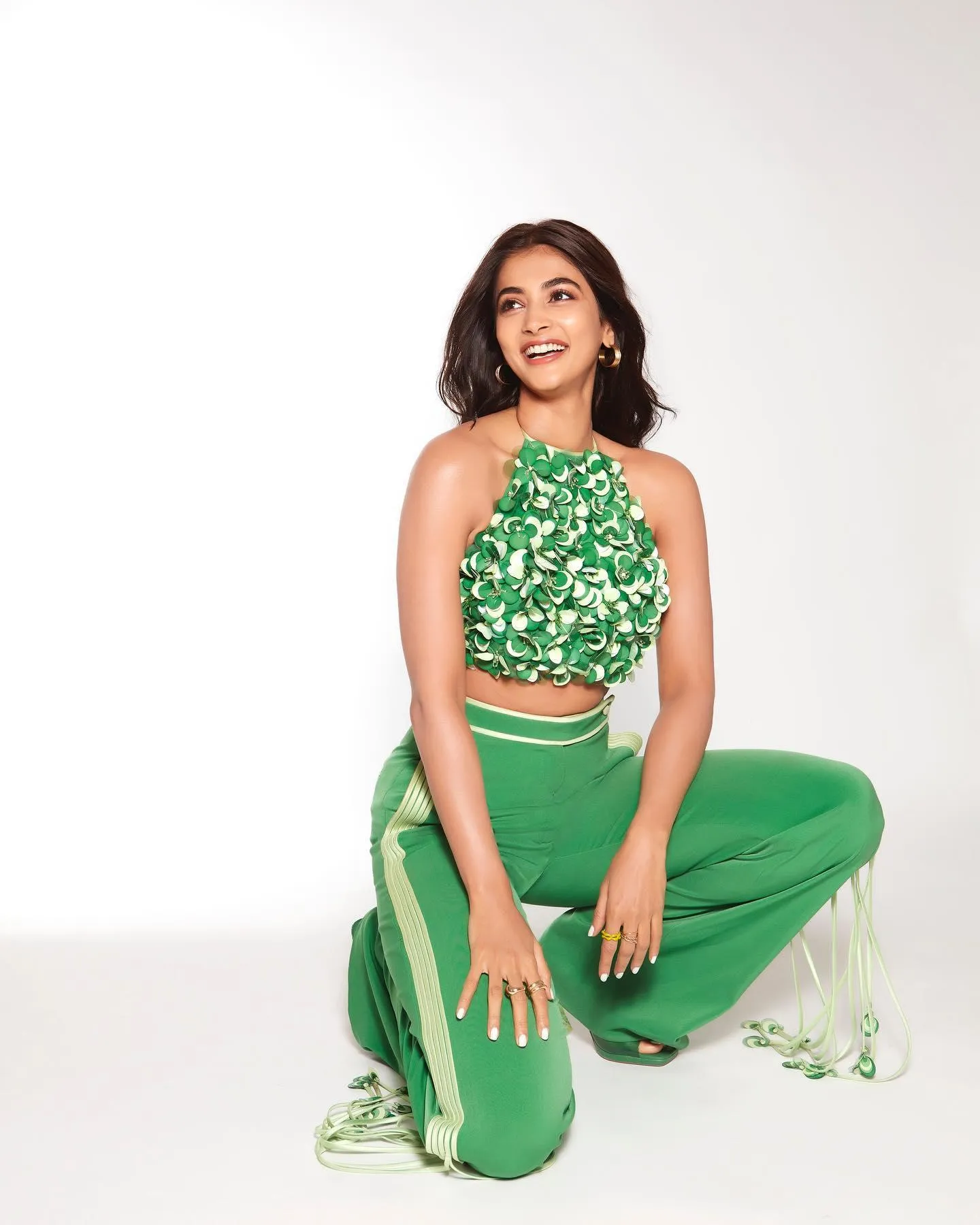 Pooja Hegde in Green Co Ord Set Posing on White Floor