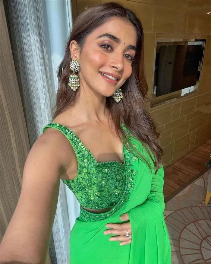 Pooja Hegde in Green Saree with Sleeveless Embellished Blouse