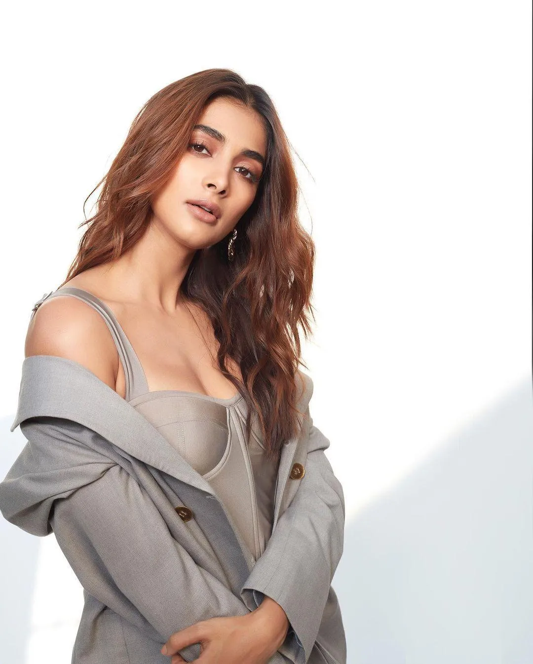 Pooja Hegde in Grey Outfit with Confident Over Shoulder Pose