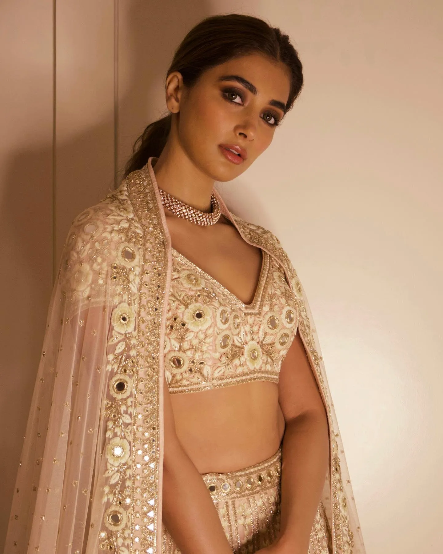 Pooja Hegde in Off White Lehenga with Elegant Style