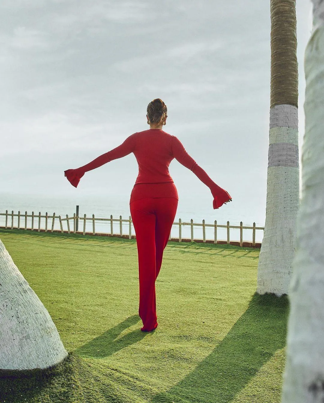 Pooja Hegde in Red Bodysuit Walking Freely Outdoors