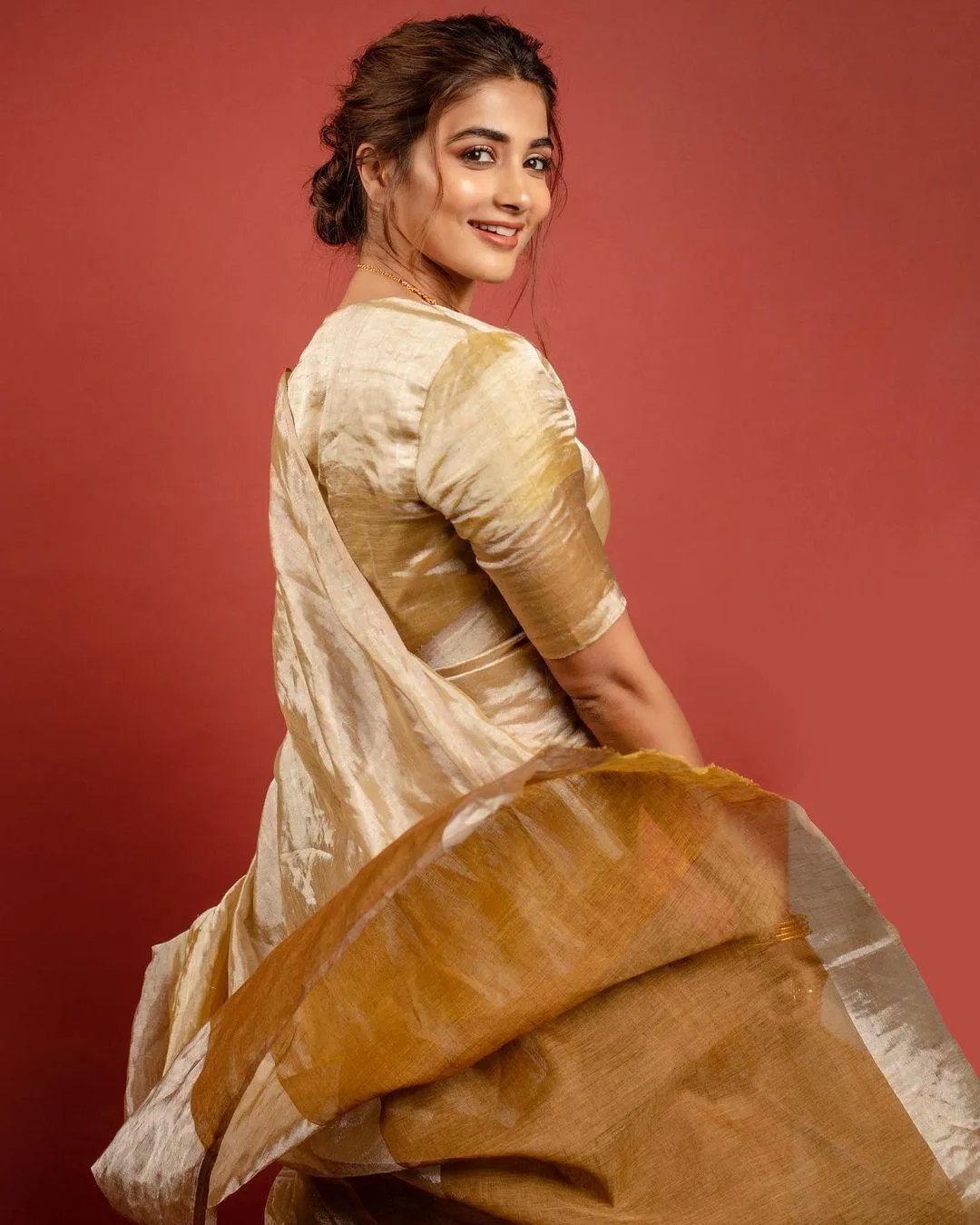 Pooja Hegde in Silk Saree Smiling Over Her Shoulder