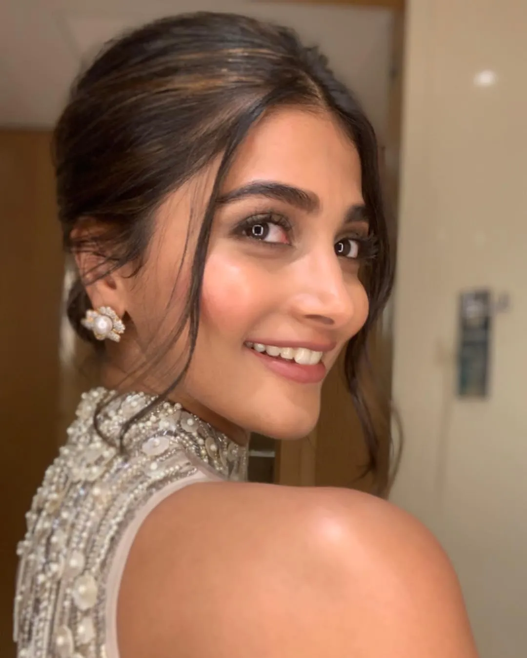 Pooja Hegde in Sleeveless Blouse with Glam Makeup and Smile