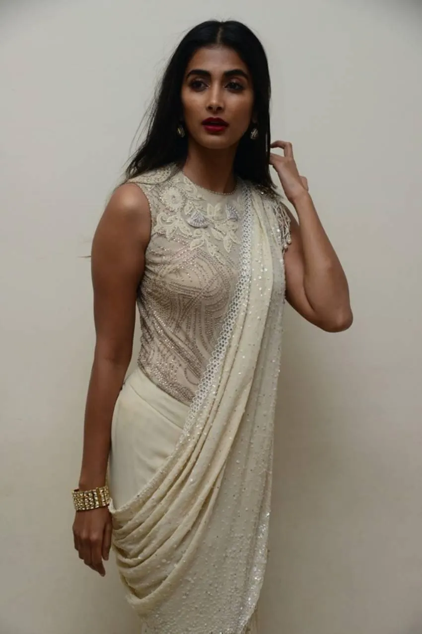 Pooja Hegde in Sleeveless Ivory Saree with Dark Lipstick