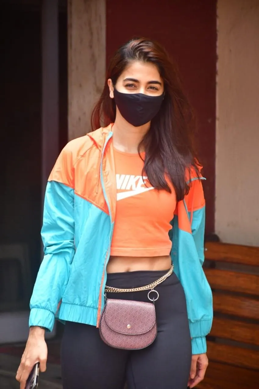 Pooja Hegde in Sporty Look with Mask and Crossbody Bag