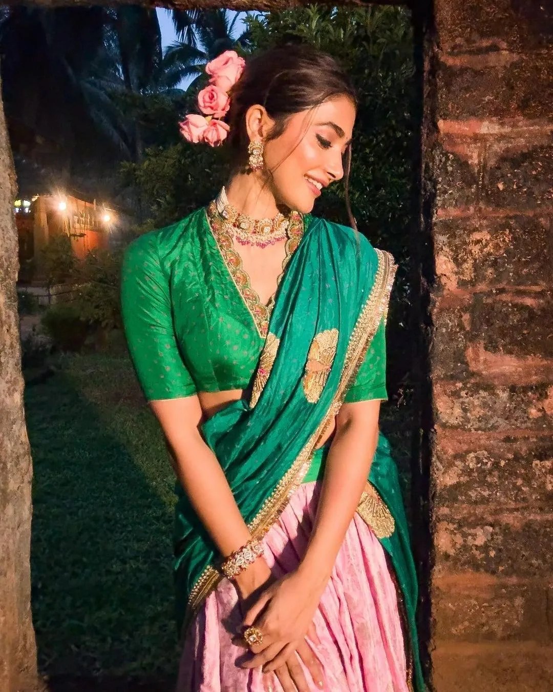 Pooja Hegde in Traditional Green Saree with Floral Hair Accessory