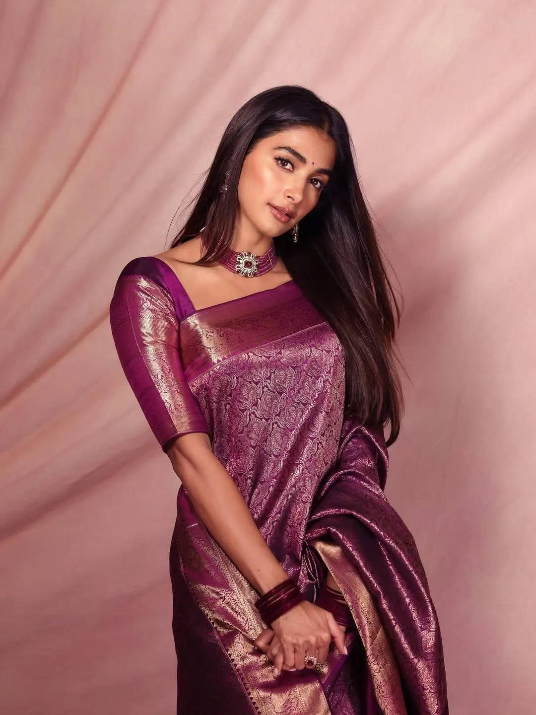 Pooja Hegde in Velvet Maroon Saree with Side Pose Image