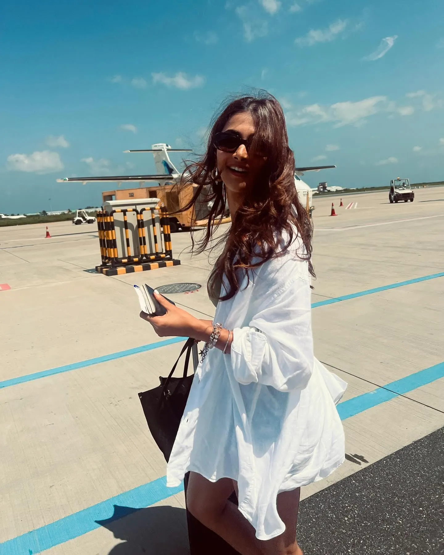 Pooja Hegde in White Dress At Airport with Summer Vibe