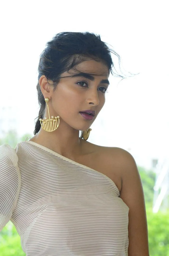 Pooja Hegde in White One Shoulder Top with Gold Earrings