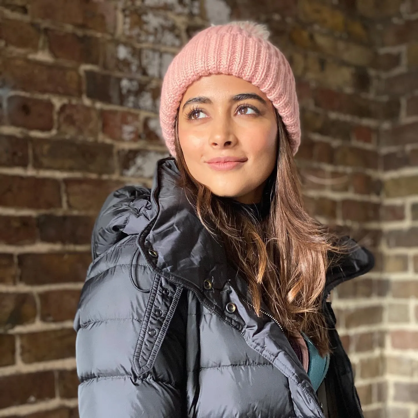 Pooja Hegde in Winter Jacket with Pink Woolen Cap Image