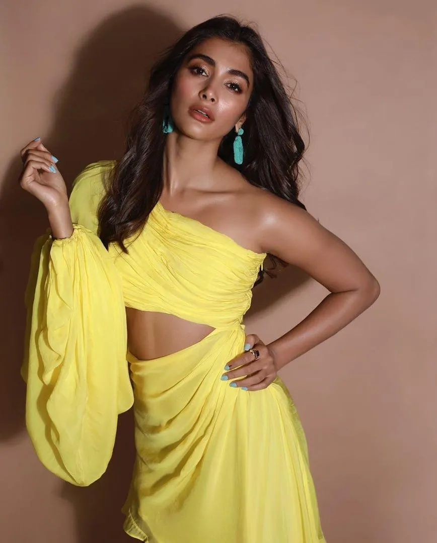 Pooja Hegde in Yellow Gown Posing with Hand on Waist