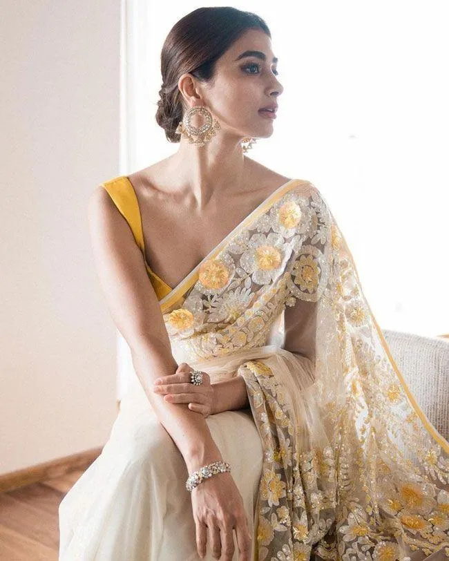 Pooja Hegde in Yellow Saree with Bun Hairstyle and Grace
