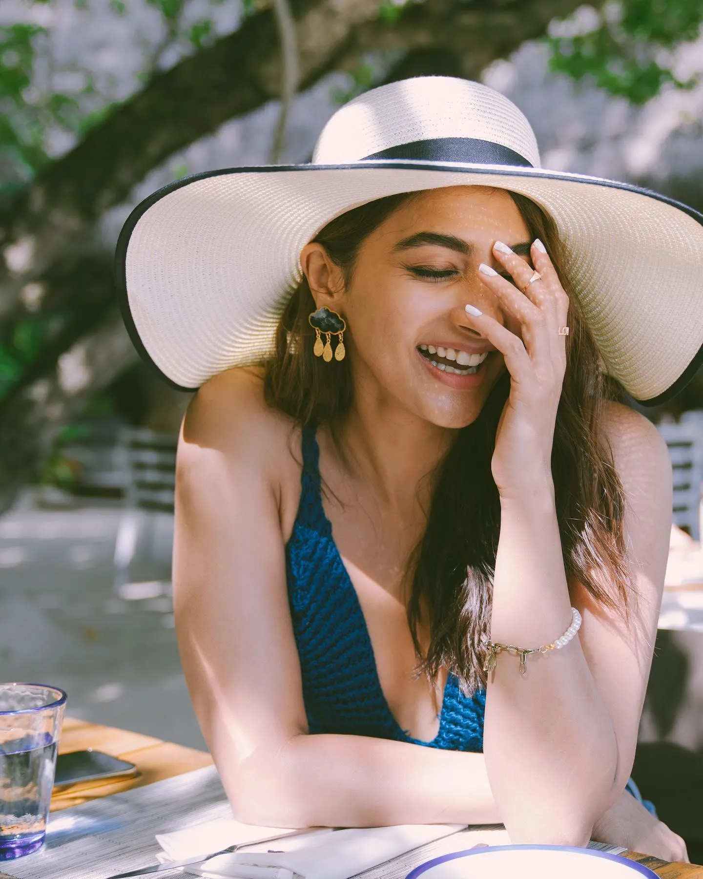 Pooja Hegde Laughing Joyfully in Summer Outfit Wallpaper