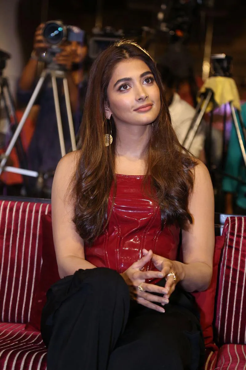 Pooja Hegde Laughs in a Red Top At a Public Event Image