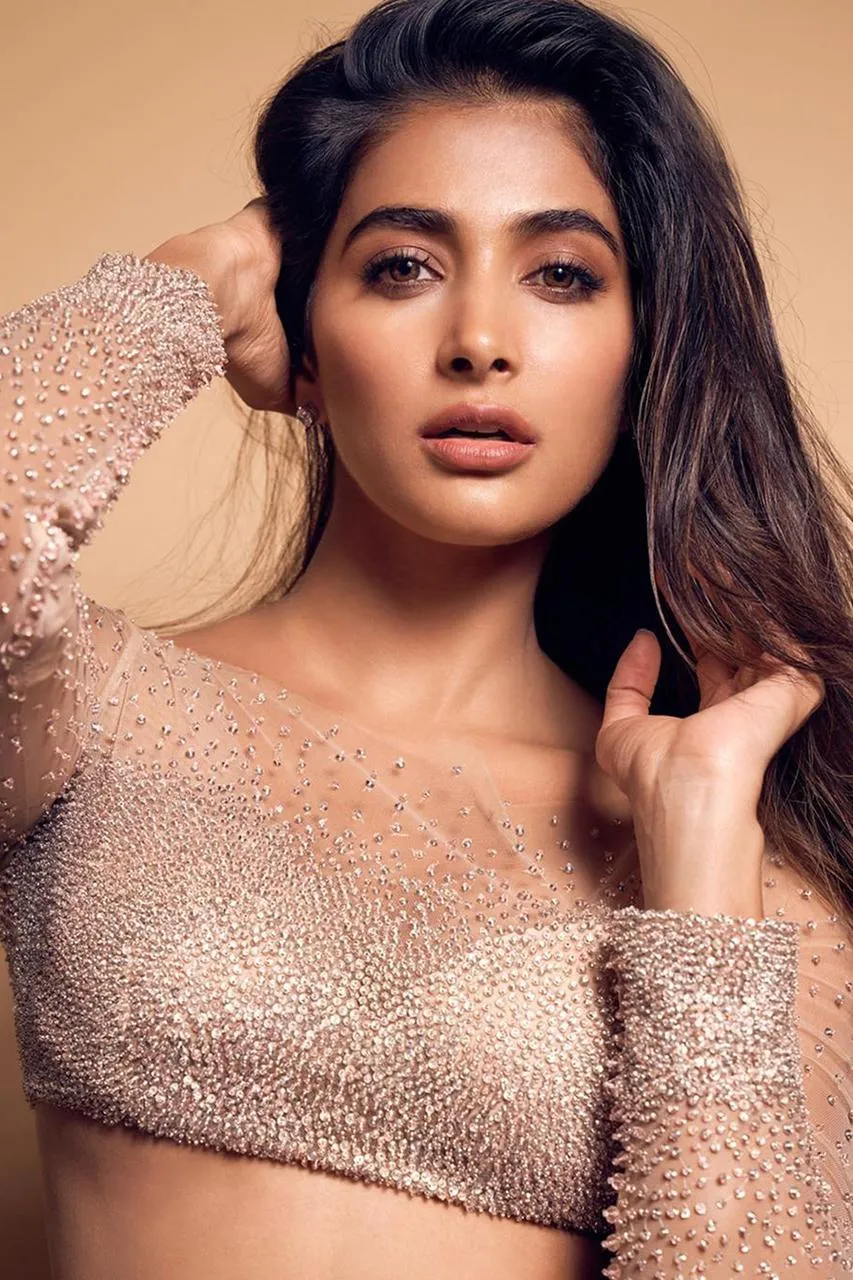 Pooja Hegde Leaning on Hand in Nude Dress with Shimmer Look