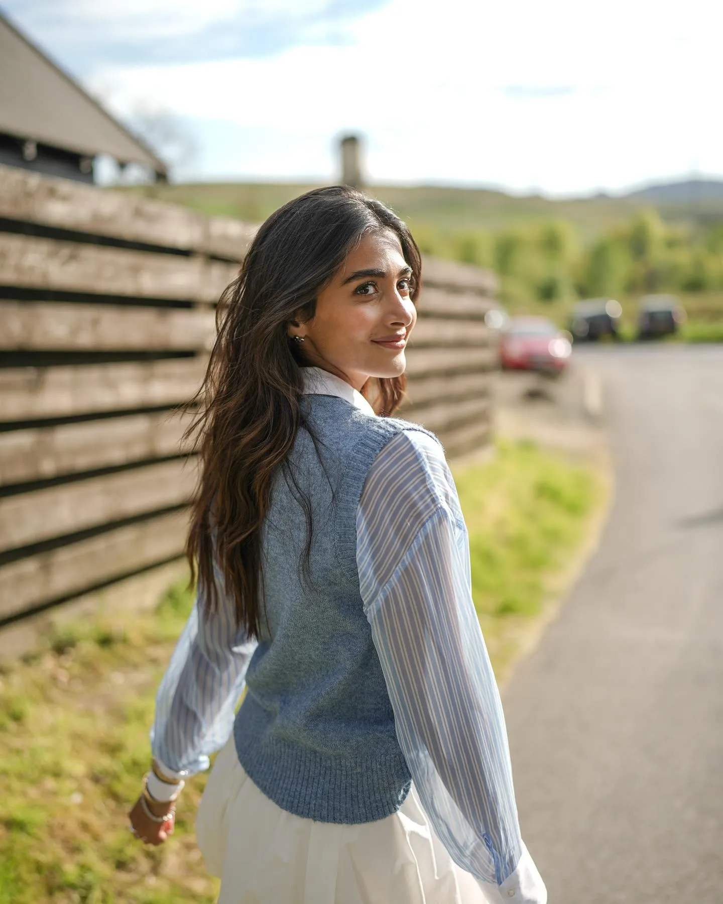 Pooja Hegde Looking Back While Walking Outdoors Image
