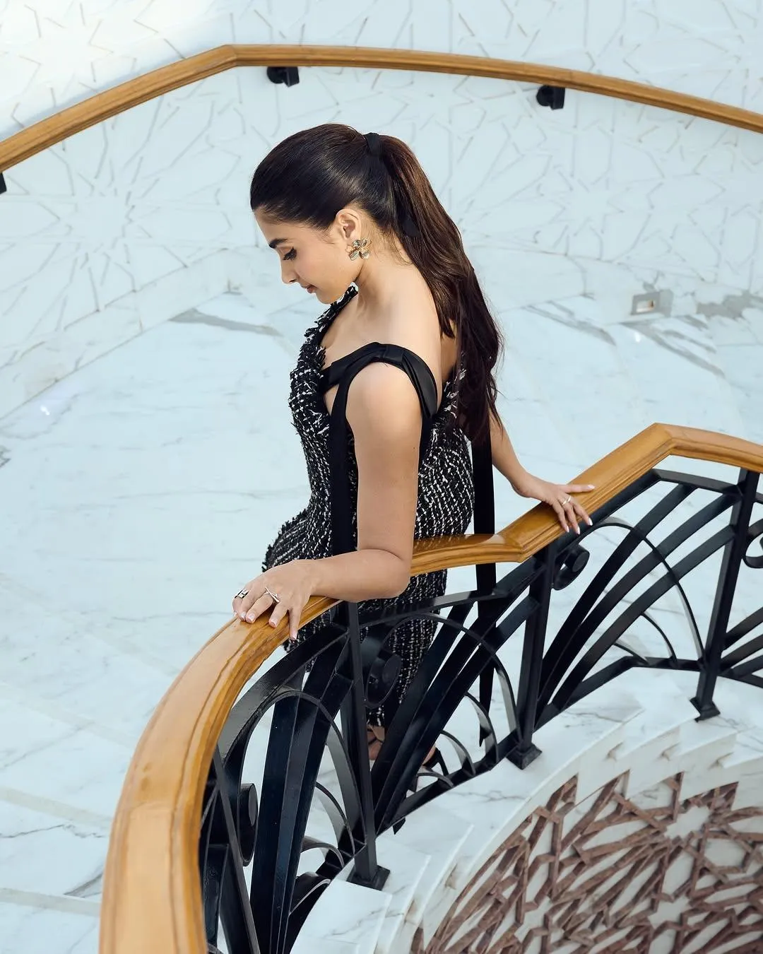 Pooja Hegde Looking Down While Sitting on Staircase Hd