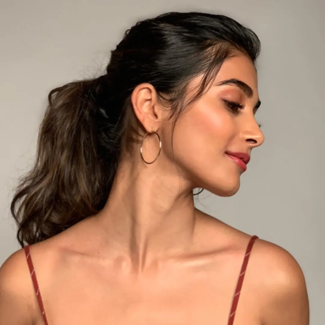 Pooja Hegde Looking Sideways in Soft Red Outfit with Ponytail