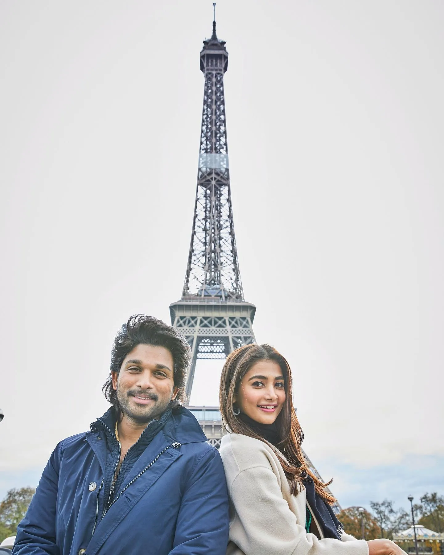 Pooja Hegde Near Eiffel Tower with Allu Arjun in Blue Jacket