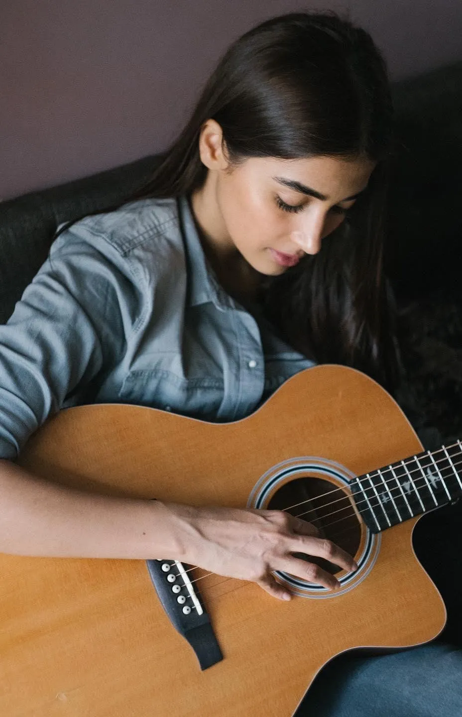Pooja Hegde Playing Acoustic Guitar in Casual Gray Sweater