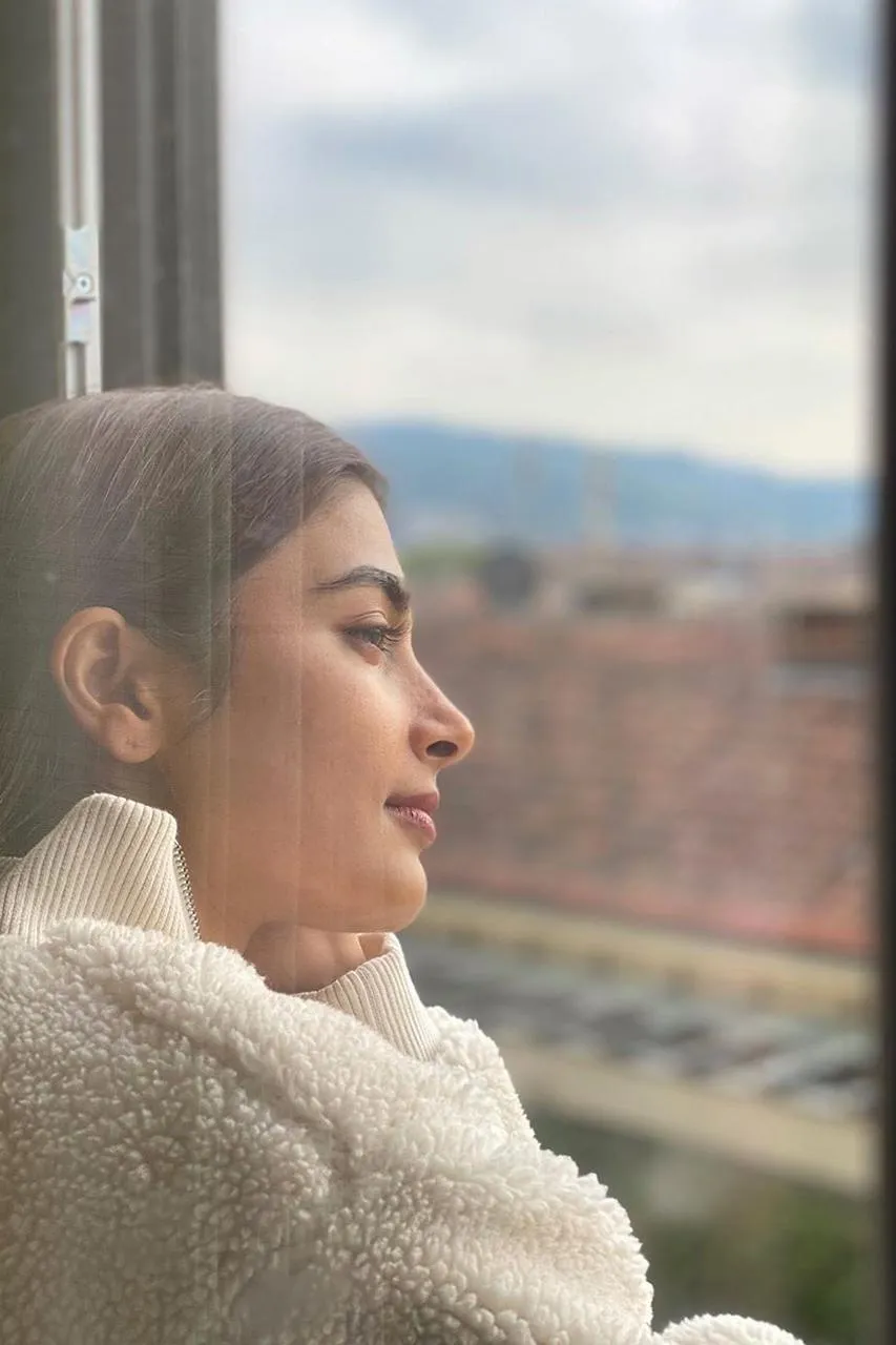 Pooja Hegde Poses By Window in Cozy Knitted White Sweater
