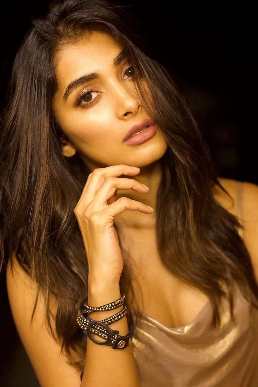 Pooja Hegde Poses Confidently in a Golden Dress Wallpaper