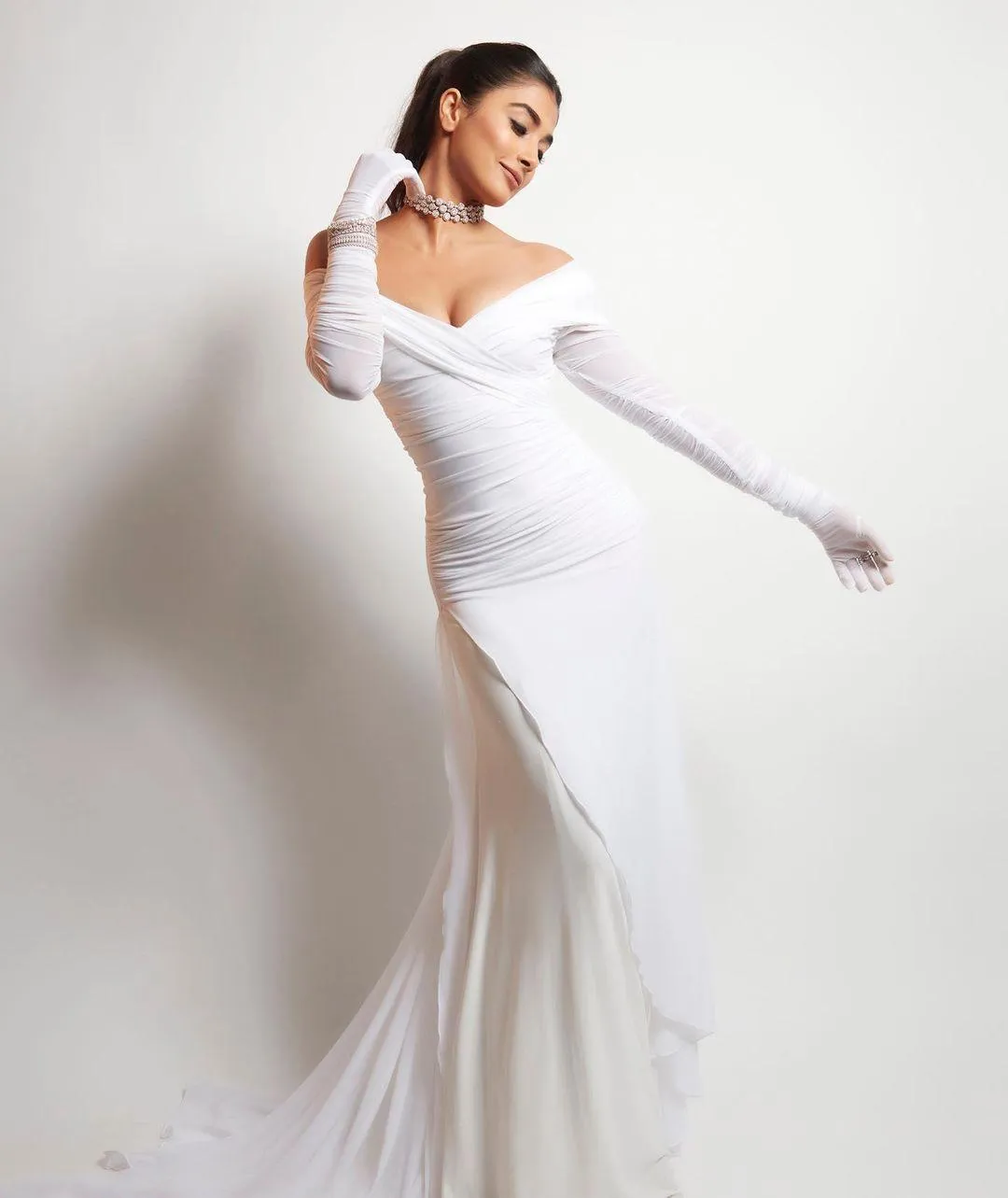 Pooja Hegde Poses Gracefully in Elegant Long White Gown