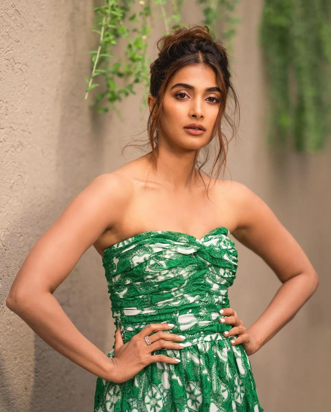 Pooja Hegde Posing Confidently in Green Strapless Dress