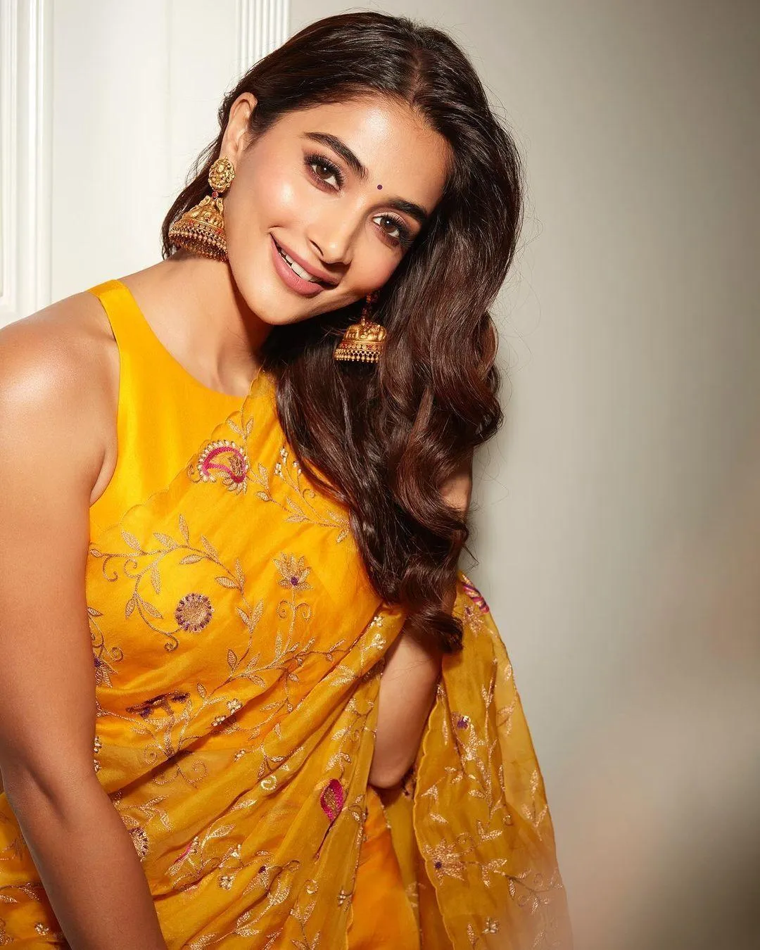 Pooja Hegde Posing Gracefully in Bright Yellow Indian Dress