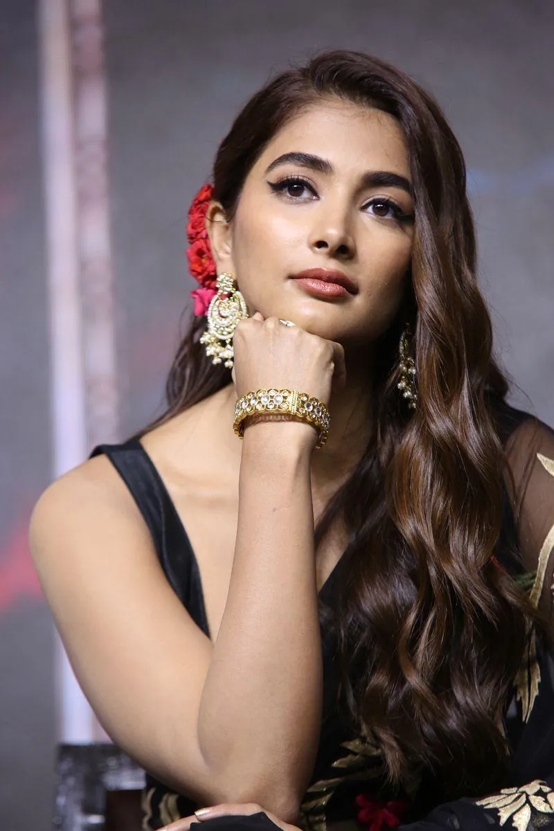 Pooja Hegde Posing in Ethnic Jewelry and Black Dress
