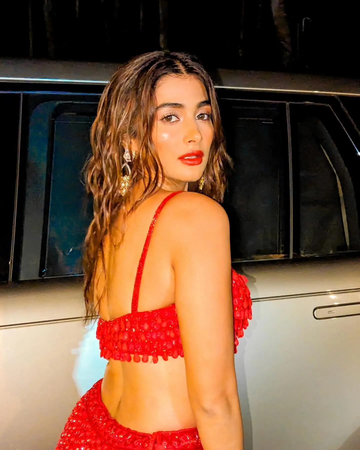 Pooja Hegde Posing in Red Two Piece Outfit Near Car