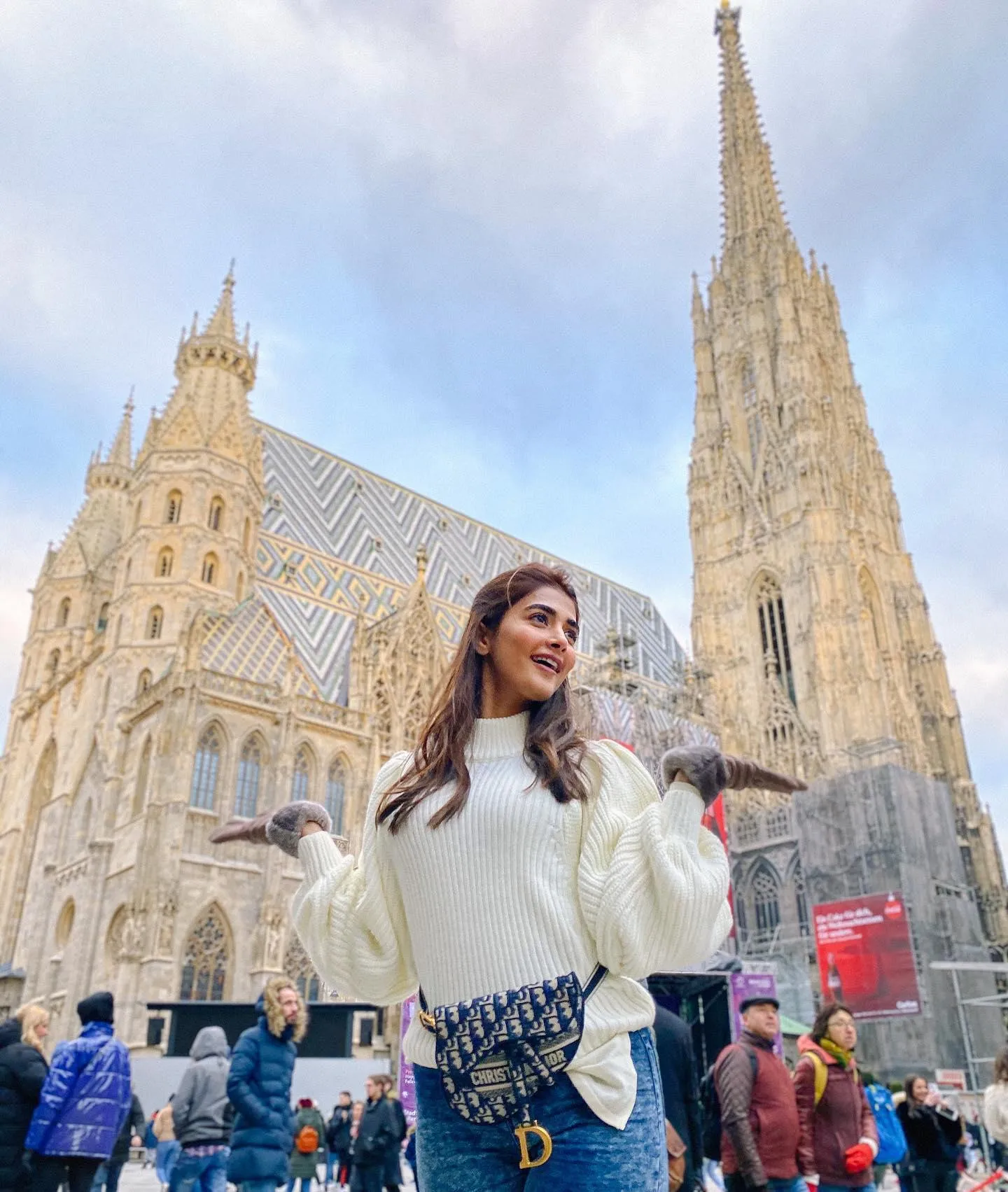 Pooja Hegde Posing Near Church with Sky in the Background