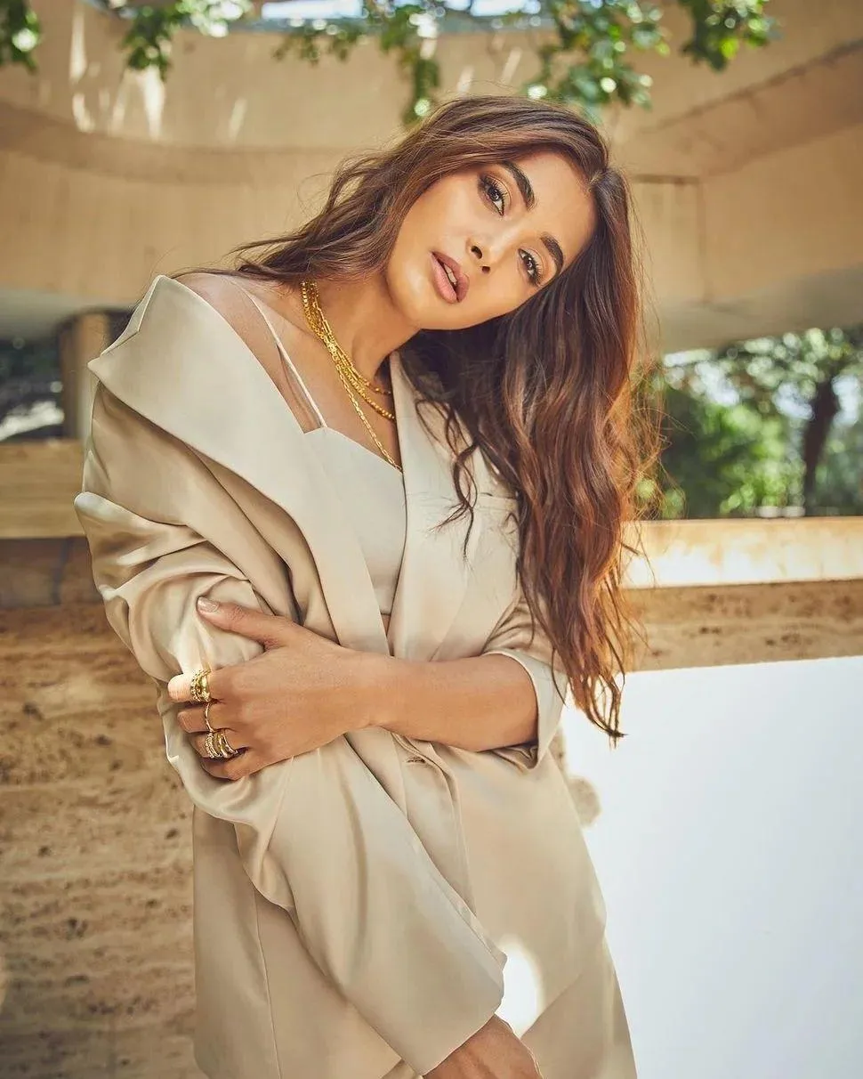 Pooja Hegde Posing Outdoors Wearing Beige Outfit Relaxed