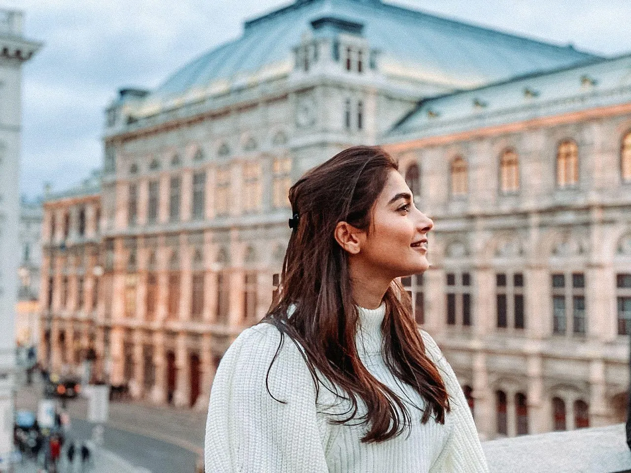 Pooja Hegde Posing Outdoors with City View in Background