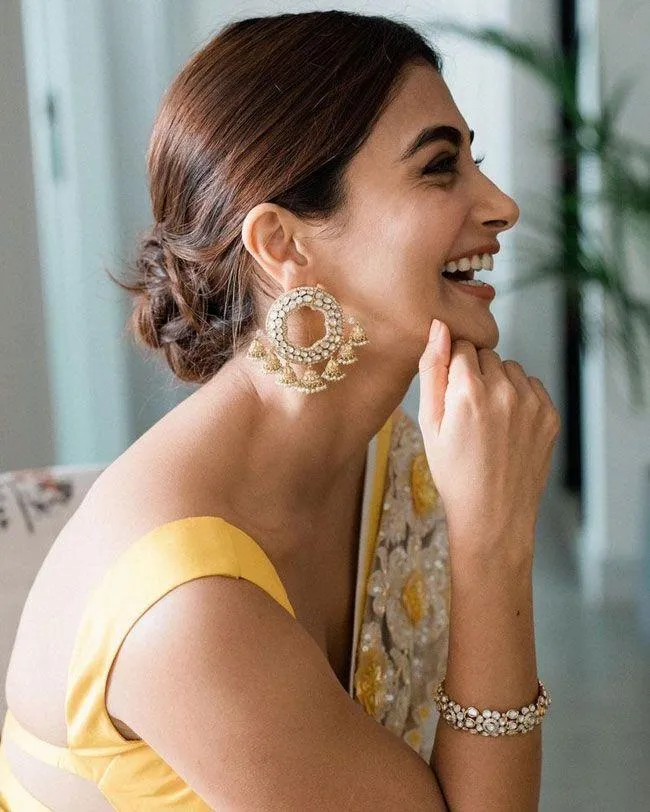 Pooja Hegde Radiates Charm in Yellow Saree and Earrings Image