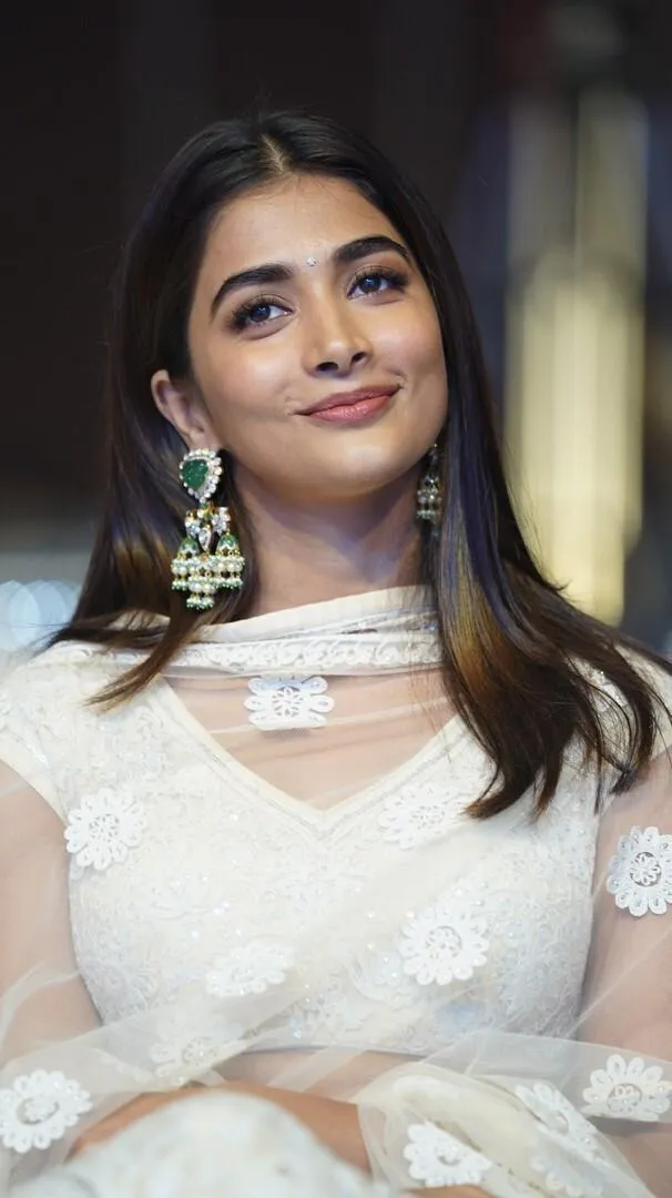 Pooja Hegde Radiates Grace in Light Pink and White Dress
