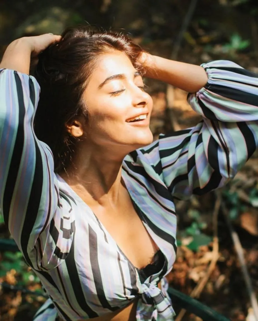Pooja Hegde Relaxing Outdoors in Striped Shirt Wallpaper