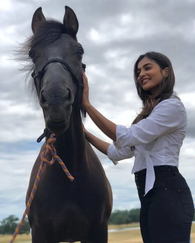 Pooja Hegde Shares Moment with Horse in White Shirt Outfit