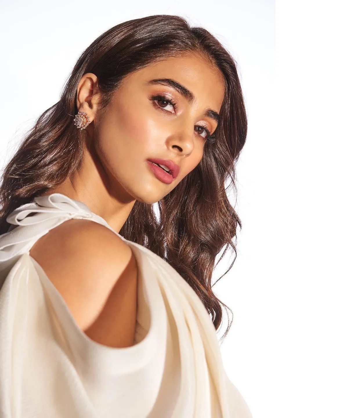 Pooja Hegde Side Pose Wearing White Dress with Open Shoulders