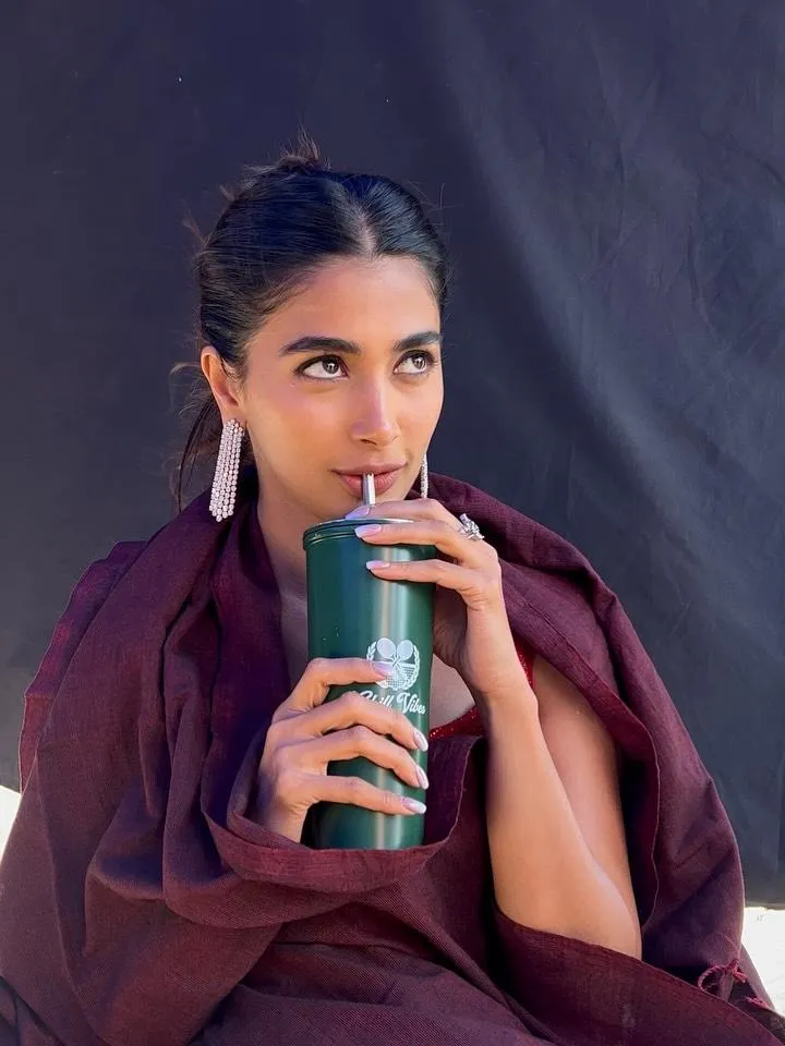 Pooja Hegde Sipping Coffee in Maroon Outfit with Charm