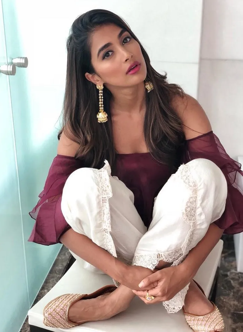Pooja Hegde Sitting Casually in Maroon Top and White