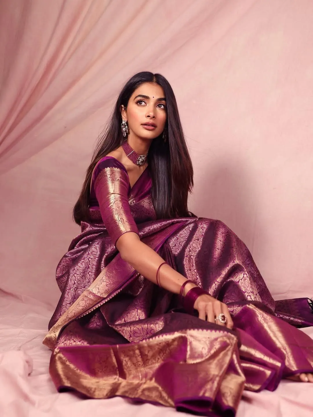 Pooja Hegde Sitting in Traditional Purple Silk Saree