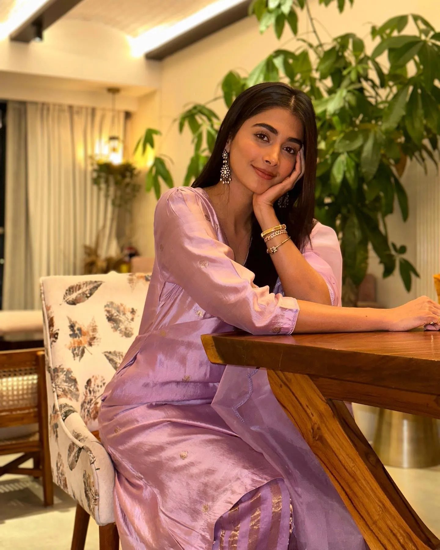 Pooja Hegde Sitting Indoors Wearing Pastel Pink Dress Smiling