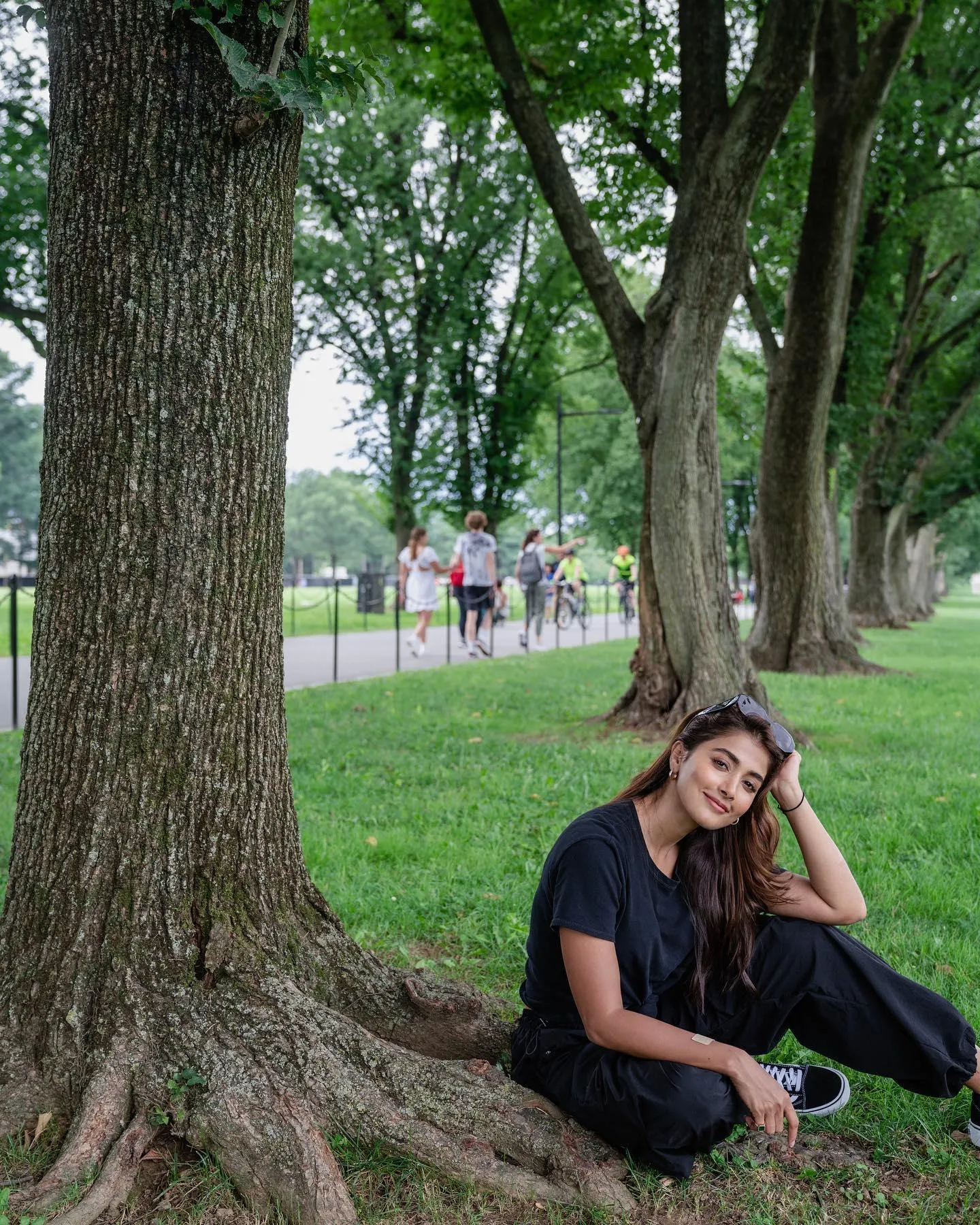 Pooja Hegde Sitting Under Trees in a Peaceful Green Park