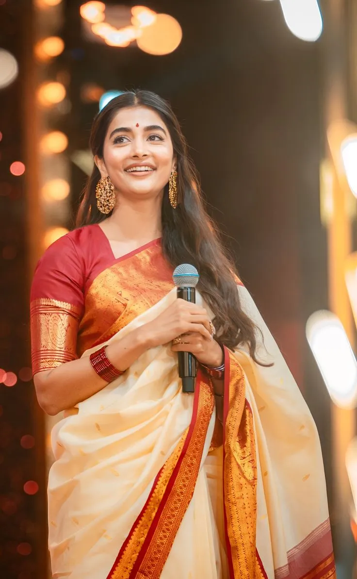Pooja Hegde Smiles in Traditional Saree Holding Microphone