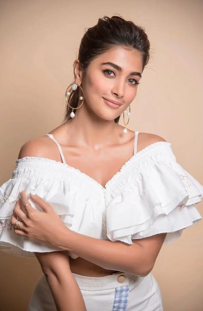 Pooja Hegde Smiles Softly Wearing An Off Shoulder Top