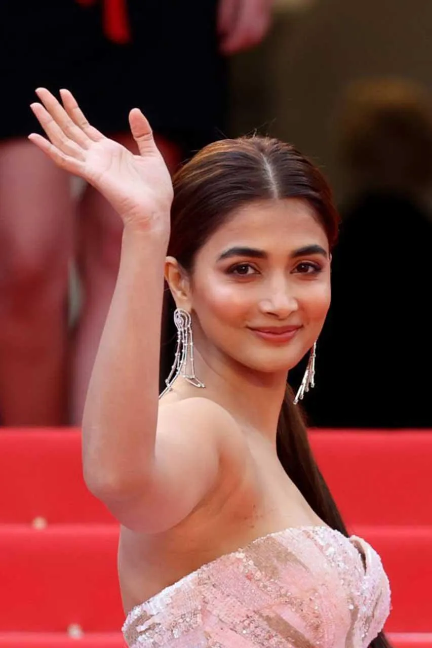 Pooja Hegde Smiling and Waving in White Gown At Film Gala