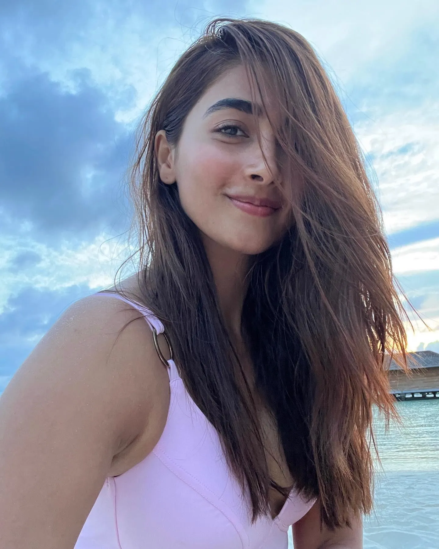 Pooja Hegde Smiling By the Sea in Casual White Top